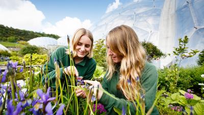 Horticulture students examining flowers at the Eden Project